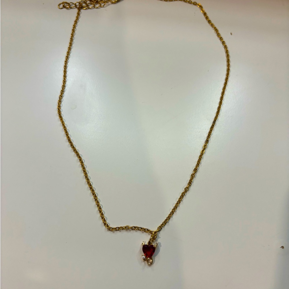 Gold necklace with heart pendant